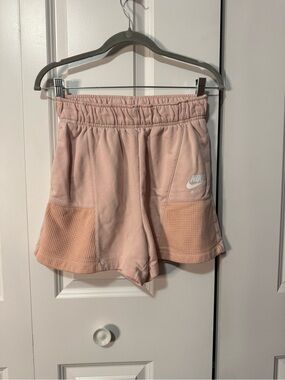 Nike Women’s Light Pink Athletic Shorts with Mesh Panels - size small